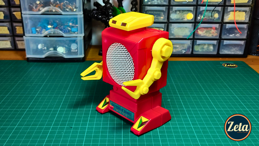 Angled view of BOMBERBOY portable guitar amplifier shaped like a robot

