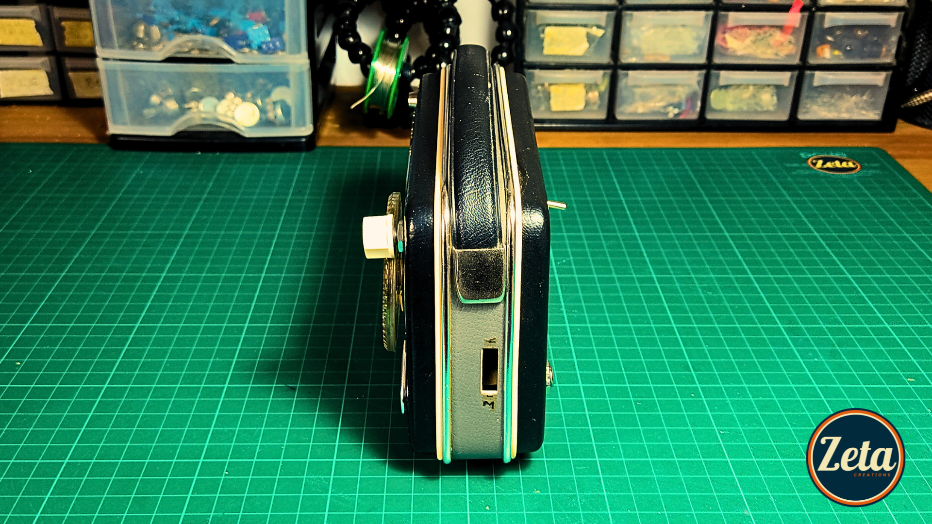 Side profile of MINERVA portable guitar amp showing vintage radio design

