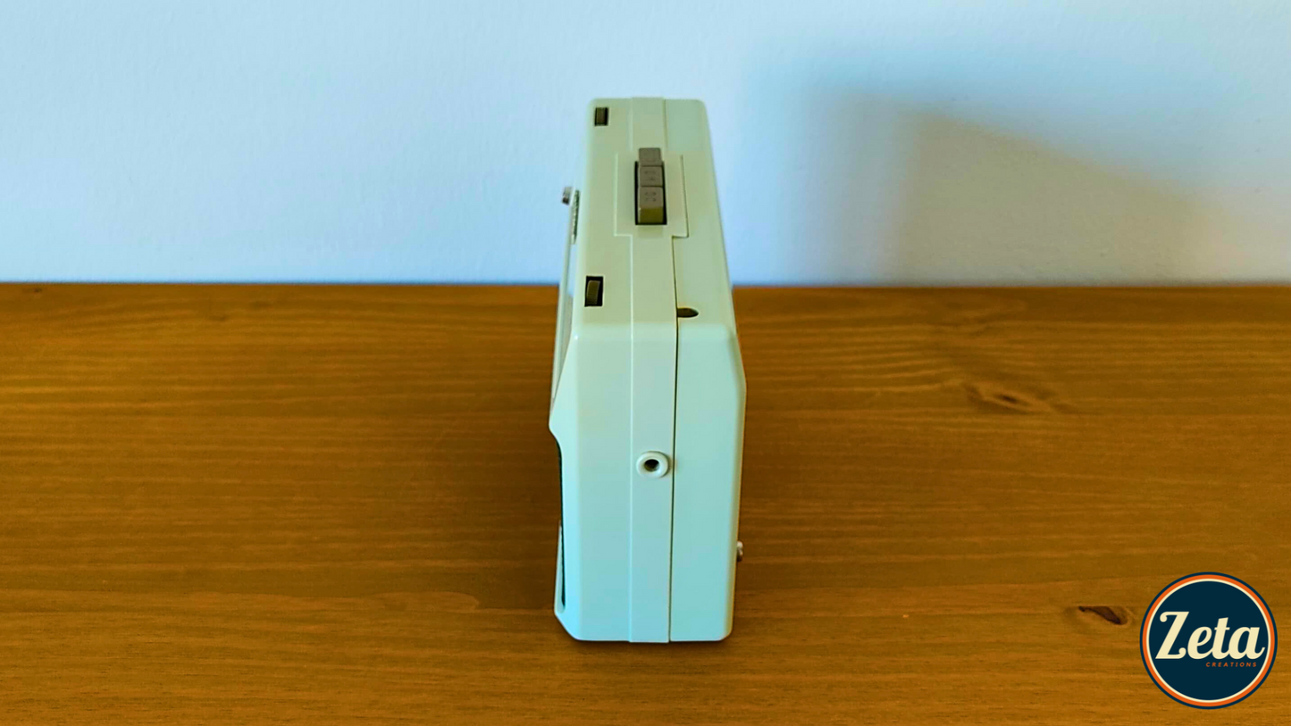 Side profile of SPRINTER portable guitar amp showing retro radio design

